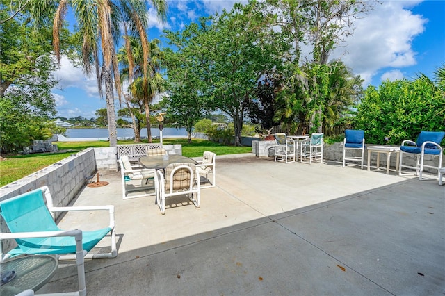 2576 Sunset Dr, New Smyrna Beach, FL 32168 - view of patio / terrace with outdoor dining space and a water view