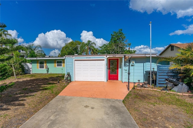 2576 Sunset Dr, New Smyrna Beach, FL 32168 - ranch-style home featuring driveway and an attached garage