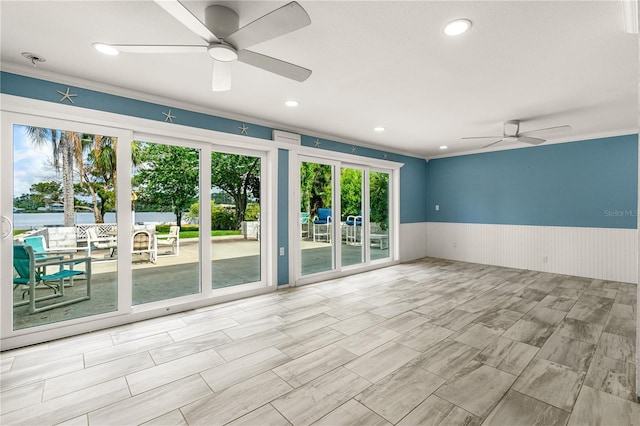 2576 Sunset Dr, New Smyrna Beach, FL 32168 - unfurnished room with ceiling fan, a wainscoted wall, ornamental molding, and recessed lighting