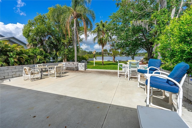 2576 Sunset Dr, New Smyrna Beach, FL 32168 - view of patio featuring an outdoor hangout area, outdoor dining area, and a water view