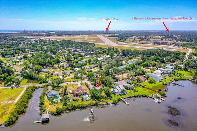 2576 Sunset Dr, New Smyrna Beach, FL 32168 - aerial perspective of suburban area with a large body of water