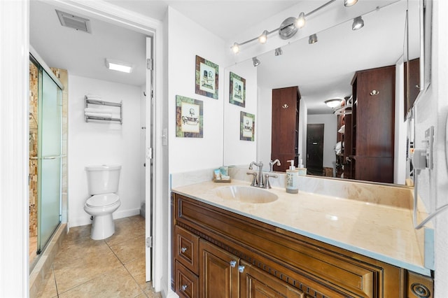 2625 S Atlantic Ave Unit 18Nw, Daytona Beach, FL 32118 - bathroom with tile patterned floors, vanity, toilet, and a shower stall