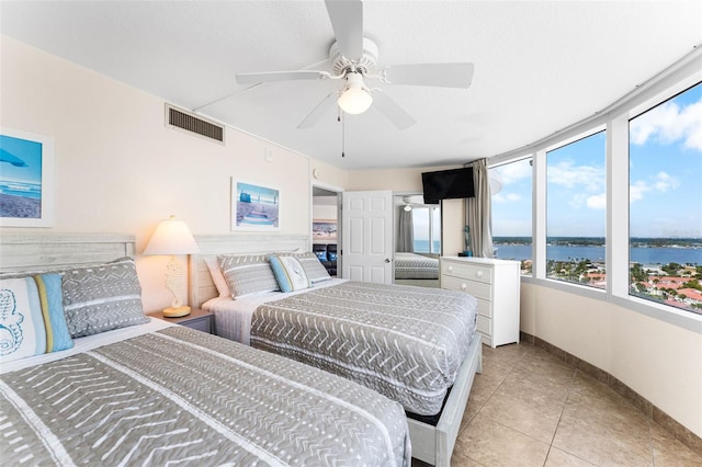 2625 S Atlantic Ave Unit 18Nw, Daytona Beach, FL 32118 - bedroom featuring baseboards, light tile patterned floors, and ceiling fan