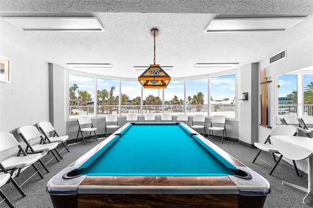 2625 S Atlantic Ave Unit 18Nw, Daytona Beach, FL 32118 - game room featuring a textured ceiling, baseboards, and billiards