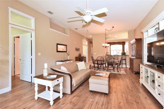 1442 Carlow Cir, Ormond Beach, FL 32174 - living area with ceiling fan, light wood-style flooring, and a chandelier