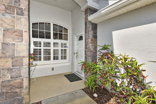 1442 Carlow Cir, Ormond Beach, FL 32174 - entrance to property featuring stone siding and stucco siding