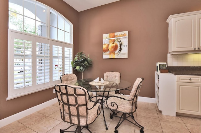 1442 Carlow Cir, Ormond Beach, FL 32174 - dining area with baseboards and light tile patterned floors