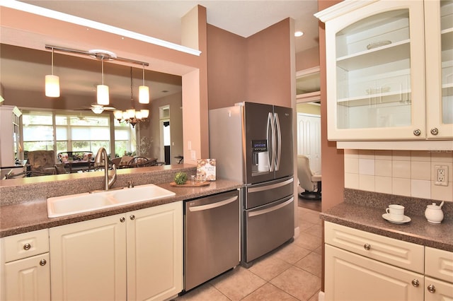 1442 Carlow Cir, Ormond Beach, FL 32174 - kitchen featuring appliances with stainless steel finishes, a sink, and dark countertops