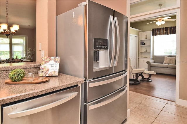 1442 Carlow Cir, Ormond Beach, FL 32174 - kitchen featuring appliances with stainless steel finishes, a chandelier, light tile patterned floors, ceiling fan, and light countertops