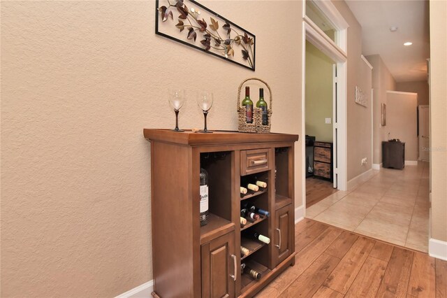 1442 Carlow Cir, Ormond Beach, FL 32174 - bar featuring light wood-style floors, baseboards, and recessed lighting