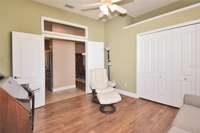 1442 Carlow Cir, Ormond Beach, FL 32174 - sitting room featuring ceiling fan, light wood-style floors, and baseboards