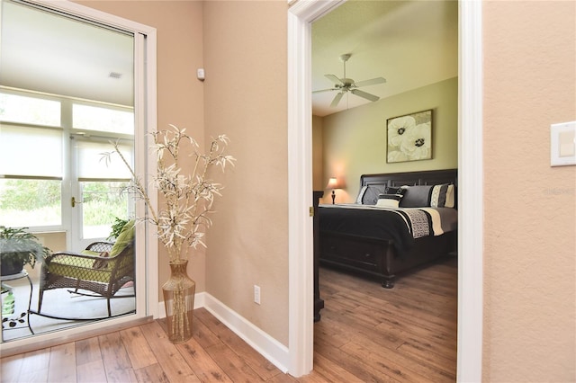 1442 Carlow Cir, Ormond Beach, FL 32174 - bedroom with hardwood / wood-style floors, baseboards, and a textured wall