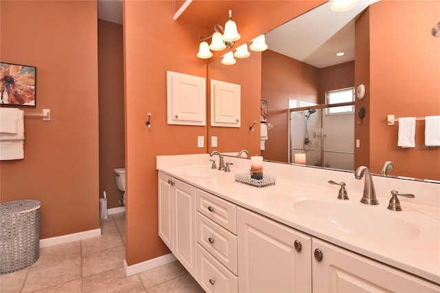 1442 Carlow Cir, Ormond Beach, FL 32174 - full bath with a shower stall, double vanity, tile patterned flooring, baseboards, and toilet