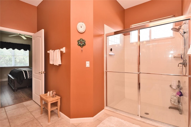1442 Carlow Cir, Ormond Beach, FL 32174 - ensuite bathroom with a stall shower, baseboards, ceiling fan, and tile patterned flooring