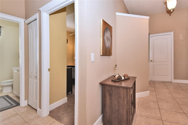 1442 Carlow Cir, Ormond Beach, FL 32174 - corridor with light tile patterned floors, baseboards, and vaulted ceiling