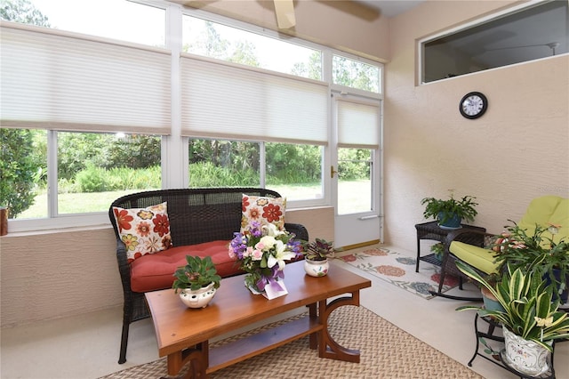 1442 Carlow Cir, Ormond Beach, FL 32174 - sunroom with ceiling fan, a textured wall, and an outdoor hangout area