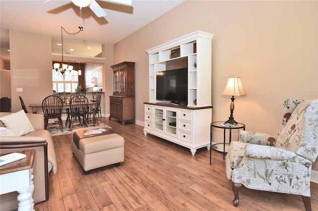 1442 Carlow Cir, Ormond Beach, FL 32174 - living area featuring a ceiling fan, light wood-type flooring, and a chandelier