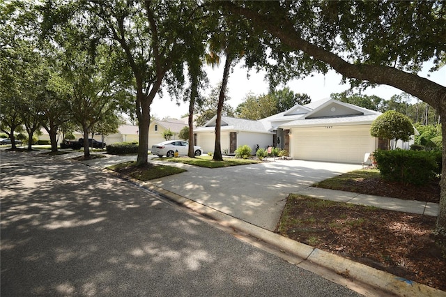 1442 Carlow Cir, Ormond Beach, FL 32174 - view of front facade with driveway and a garage