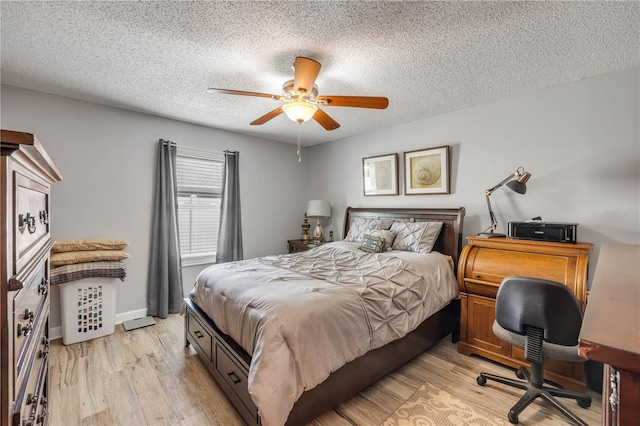 1205 Bond St, Edgewater, FL 32132 - bedroom with a textured ceiling, light wood-style flooring, and a ceiling fan