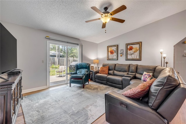 1205 Bond St, Edgewater, FL 32132 - living area with a ceiling fan, light wood-type flooring, a textured ceiling, lofted ceiling, and baseboards