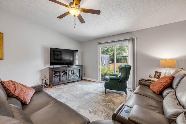 1205 Bond St, Edgewater, FL 32132 - living area with vaulted ceiling, ceiling fan, a textured ceiling, wood finished floors, and baseboards
