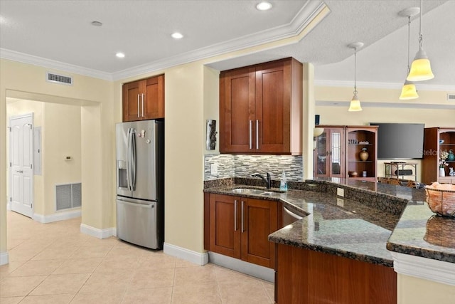 3245 S Atlantic Ave Unit 208, Daytona Beach, FL 32118 - kitchen featuring stainless steel fridge with ice dispenser, a sink, dark stone counters, decorative backsplash, and decorative light fixtures