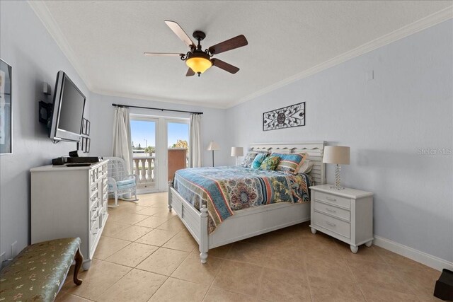 3245 S Atlantic Ave Unit 208, Daytona Beach, FL 32118 - bedroom featuring access to exterior, light tile patterned floors, ornamental molding, baseboards, and ceiling fan