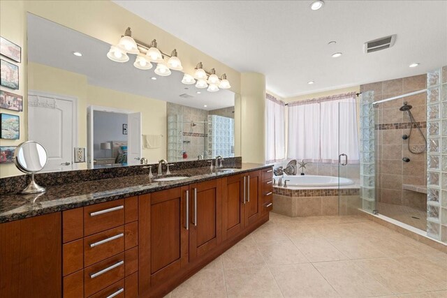 3245 S Atlantic Ave Unit 208, Daytona Beach, FL 32118 - bathroom with a shower stall, a garden tub, tile patterned floors, vanity, and recessed lighting