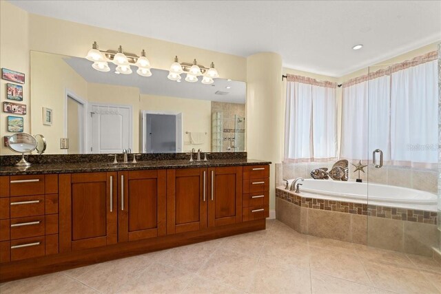 3245 S Atlantic Ave Unit 208, Daytona Beach, FL 32118 - full bathroom with a shower stall, a bath, tile patterned floors, and double vanity