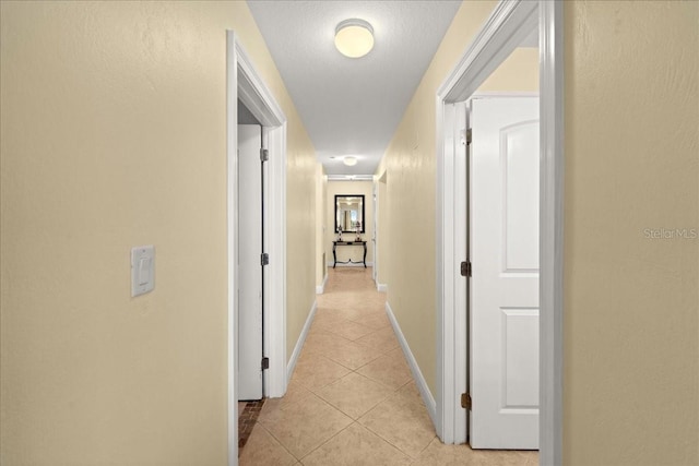 3245 S Atlantic Ave Unit 208, Daytona Beach, FL 32118 - hall featuring light tile patterned floors and baseboards