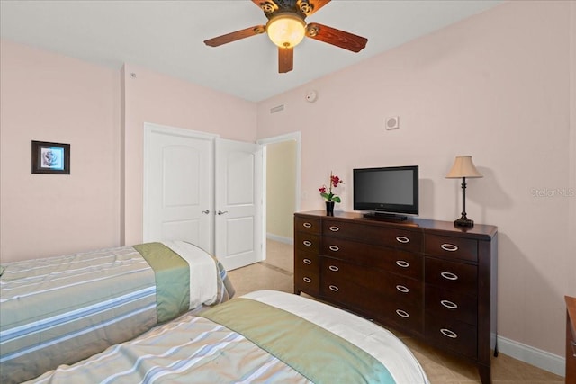 3245 S Atlantic Ave Unit 208, Daytona Beach, FL 32118 - bedroom with baseboards, light tile patterned floors, and ceiling fan