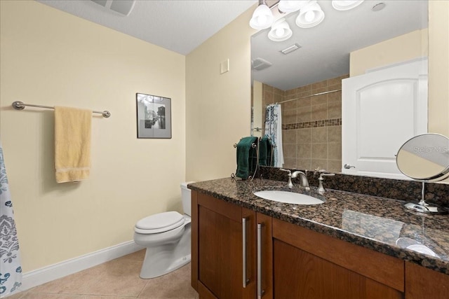 3245 S Atlantic Ave Unit 208, Daytona Beach, FL 32118 - full bath with baseboards, tile patterned flooring, toilet, tiled shower, and vanity