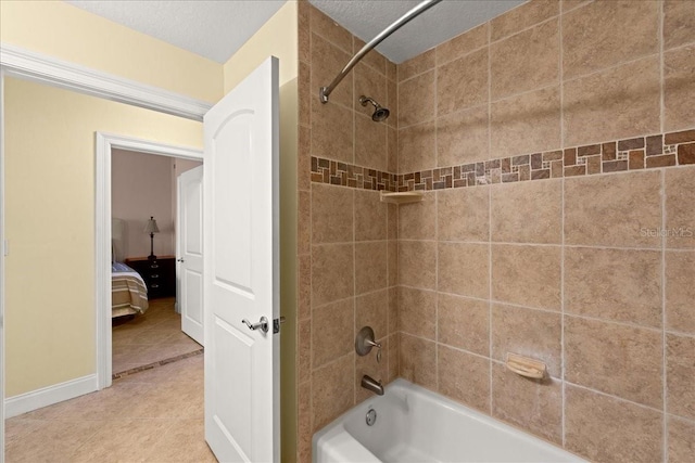 3245 S Atlantic Ave Unit 208, Daytona Beach, FL 32118 - full bathroom with  shower combination, tile patterned floors, and baseboards