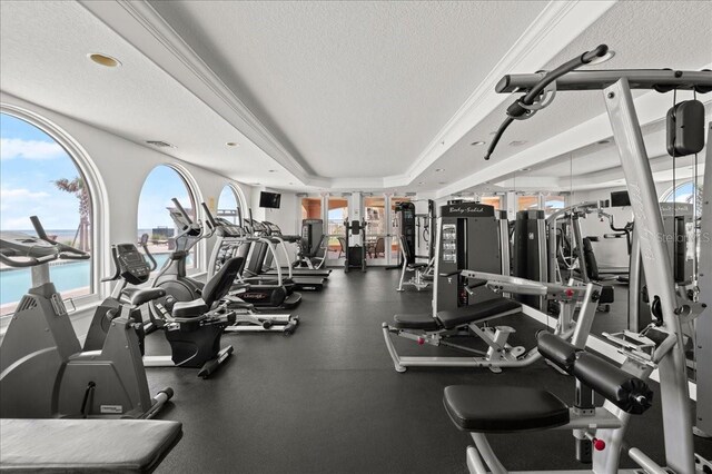 3245 S Atlantic Ave Unit 208, Daytona Beach, FL 32118 - exercise room with a textured ceiling and a raised ceiling