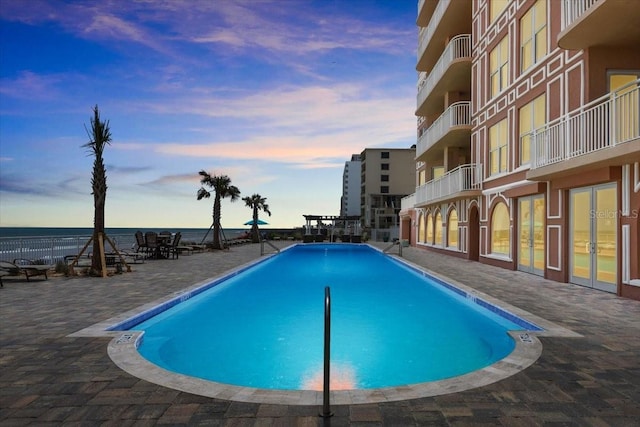 3245 S Atlantic Ave Unit 208, Daytona Beach, FL 32118 - community pool featuring a patio and a water view