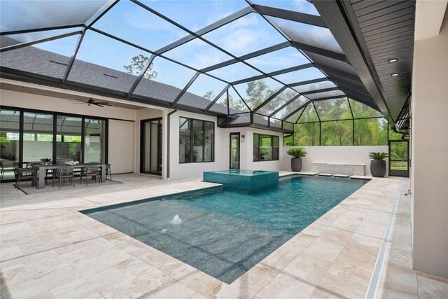 1624 Turnbull Crossings Dr, New Smyrna Beach, FL 32168 - view of swimming pool featuring ceiling fan, a patio, a pool with connected hot tub, outdoor dining area, and a lanai