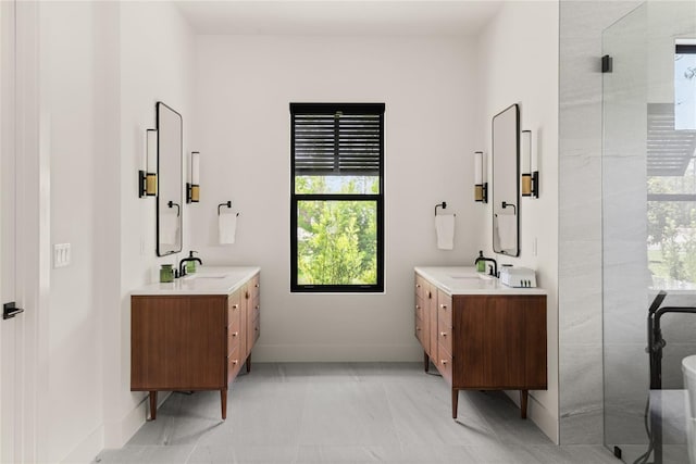 1624 Turnbull Crossings Dr, New Smyrna Beach, FL 32168 - bathroom with plenty of natural light, two vanities, and baseboards