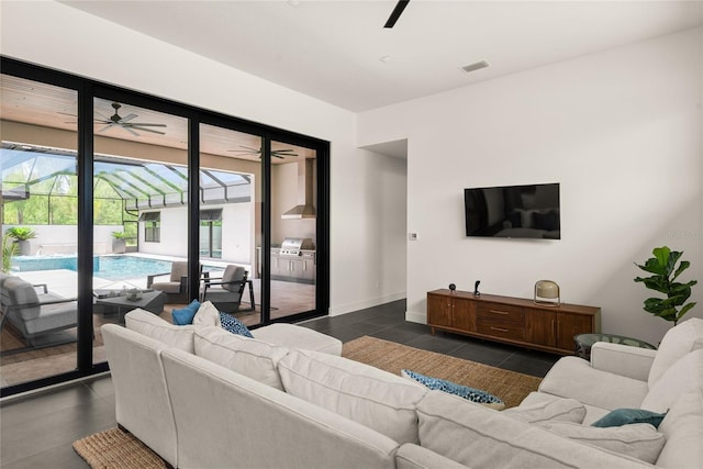 1624 Turnbull Crossings Dr, New Smyrna Beach, FL 32168 - living area featuring a ceiling fan and a sunroom