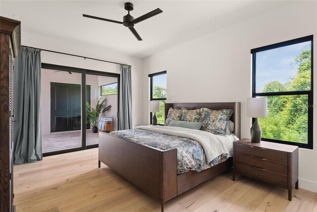 1624 Turnbull Crossings Dr, New Smyrna Beach, FL 32168 - bedroom featuring access to outside, light wood finished floors, ceiling fan, and baseboards