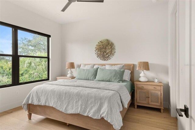 1624 Turnbull Crossings Dr, New Smyrna Beach, FL 32168 - bedroom featuring light wood-style floors, baseboards, and ceiling fan