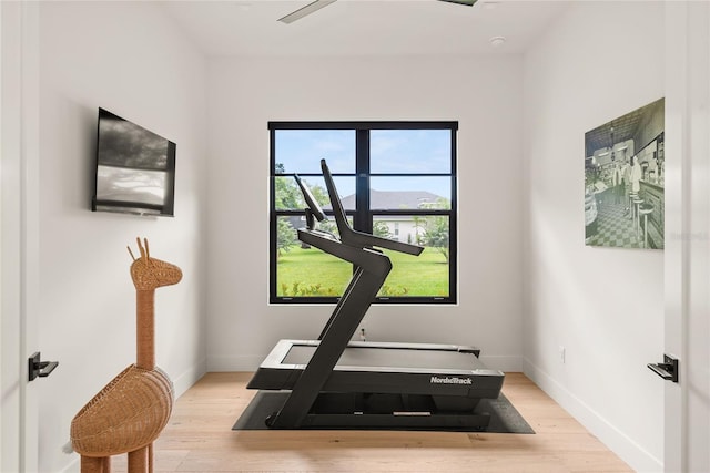 1624 Turnbull Crossings Dr, New Smyrna Beach, FL 32168 - exercise room featuring light wood-style floors and baseboards