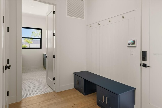 1624 Turnbull Crossings Dr, New Smyrna Beach, FL 32168 - mudroom featuring light wood-style floors and baseboards