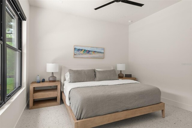 1624 Turnbull Crossings Dr, New Smyrna Beach, FL 32168 - bedroom featuring baseboards, speckled floor, multiple windows, and ceiling fan