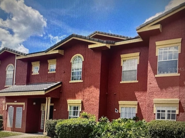 240 Villa Di Este Ter Unit 212, Lake Mary, FL 32746 - townhome / multi-family property with stucco siding and a tile roof