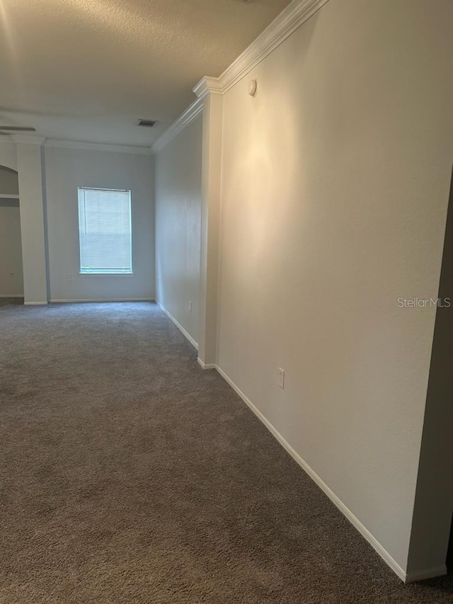 240 Villa Di Este Ter Unit 212, Lake Mary, FL 32746 - carpeted empty room with ornamental molding, baseboards, and a textured ceiling