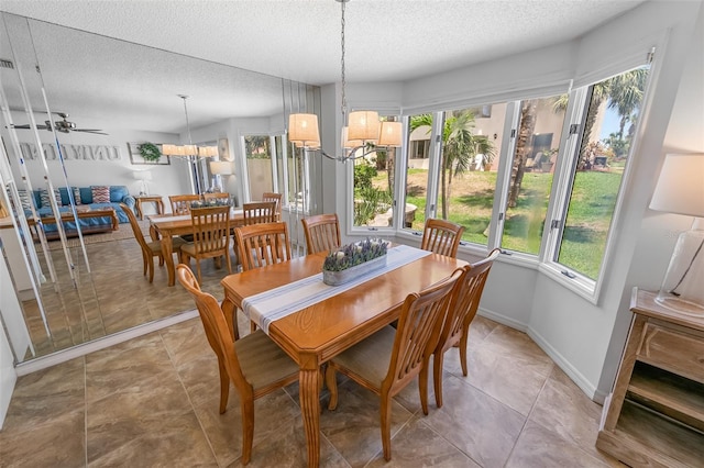2961 Oceans Trce, Daytona Beach Shores, FL 32118 - dining area with a textured ceiling and baseboards