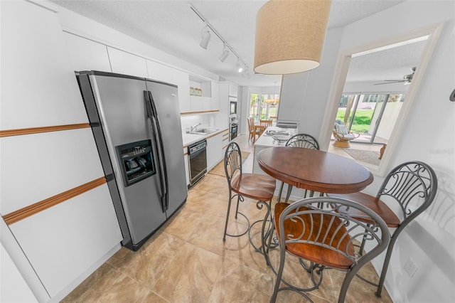 2961 Oceans Trce, Daytona Beach Shores, FL 32118 - kitchen featuring stainless steel appliances, white cabinets, light countertops, modern cabinets, and a sink