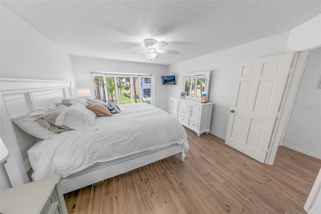 2961 Oceans Trce, Daytona Beach Shores, FL 32118 - bedroom with a textured ceiling, light wood-style floors, and ceiling fan