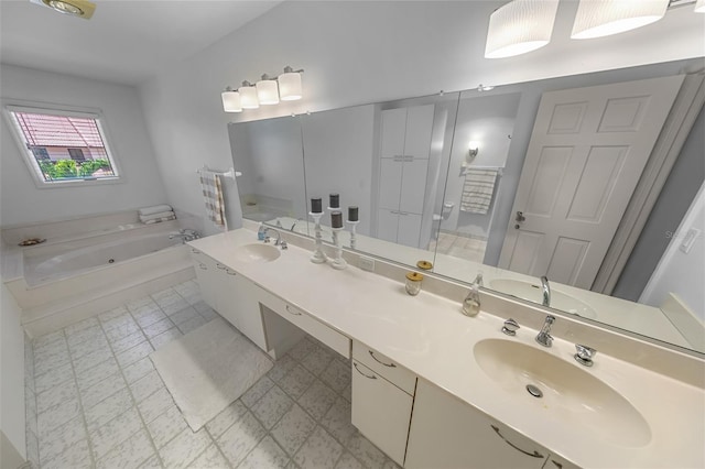 2961 Oceans Trce, Daytona Beach Shores, FL 32118 - bathroom featuring a garden tub, tile patterned floors, and double vanity