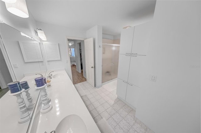 2961 Oceans Trce, Daytona Beach Shores, FL 32118 - full bath with a shower stall, double vanity, and tile patterned floors